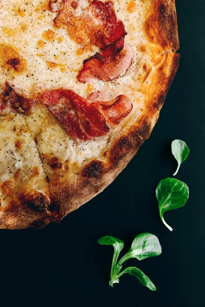 Freshly baked specialty pizza at Roma's Pizzeria in Bridgeland, Calgary